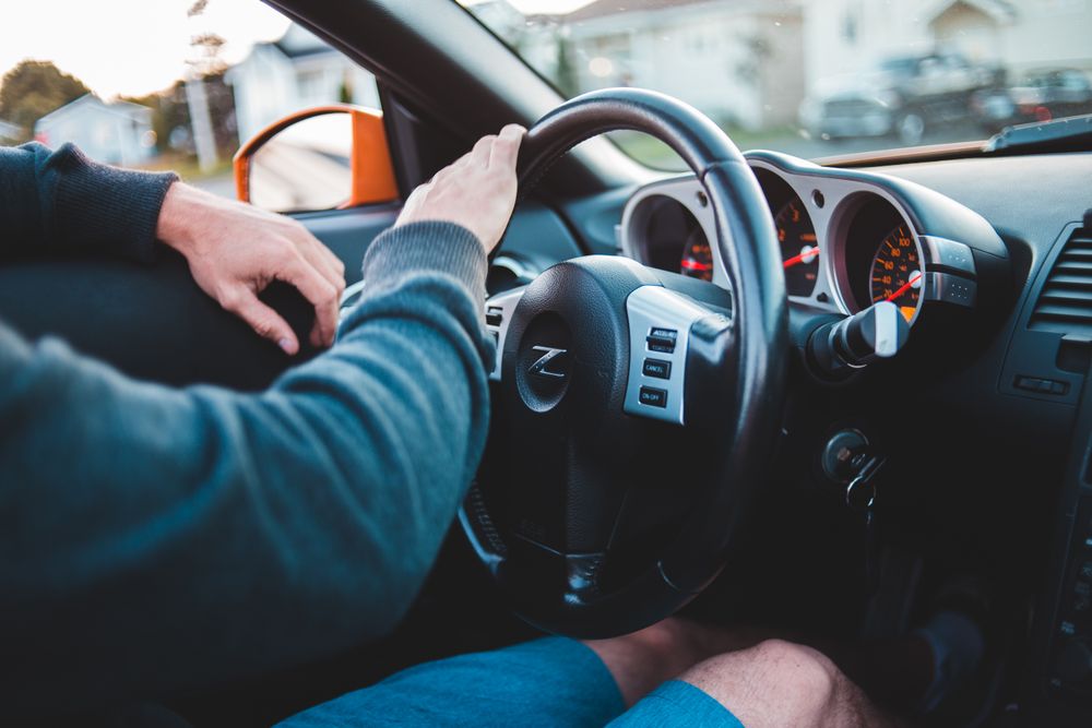A driver at the wheel of a car