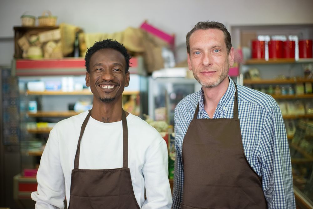 Two small-business owners in their shop